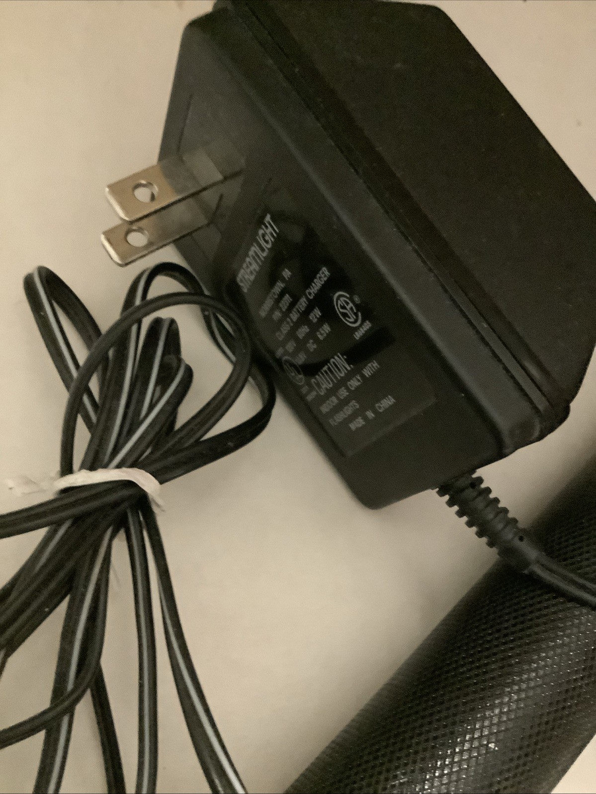PRE-OWNED FLASHLIGHT, CHARGER 110VOLT, AND CRADLE RECHARGABLE STINGER
