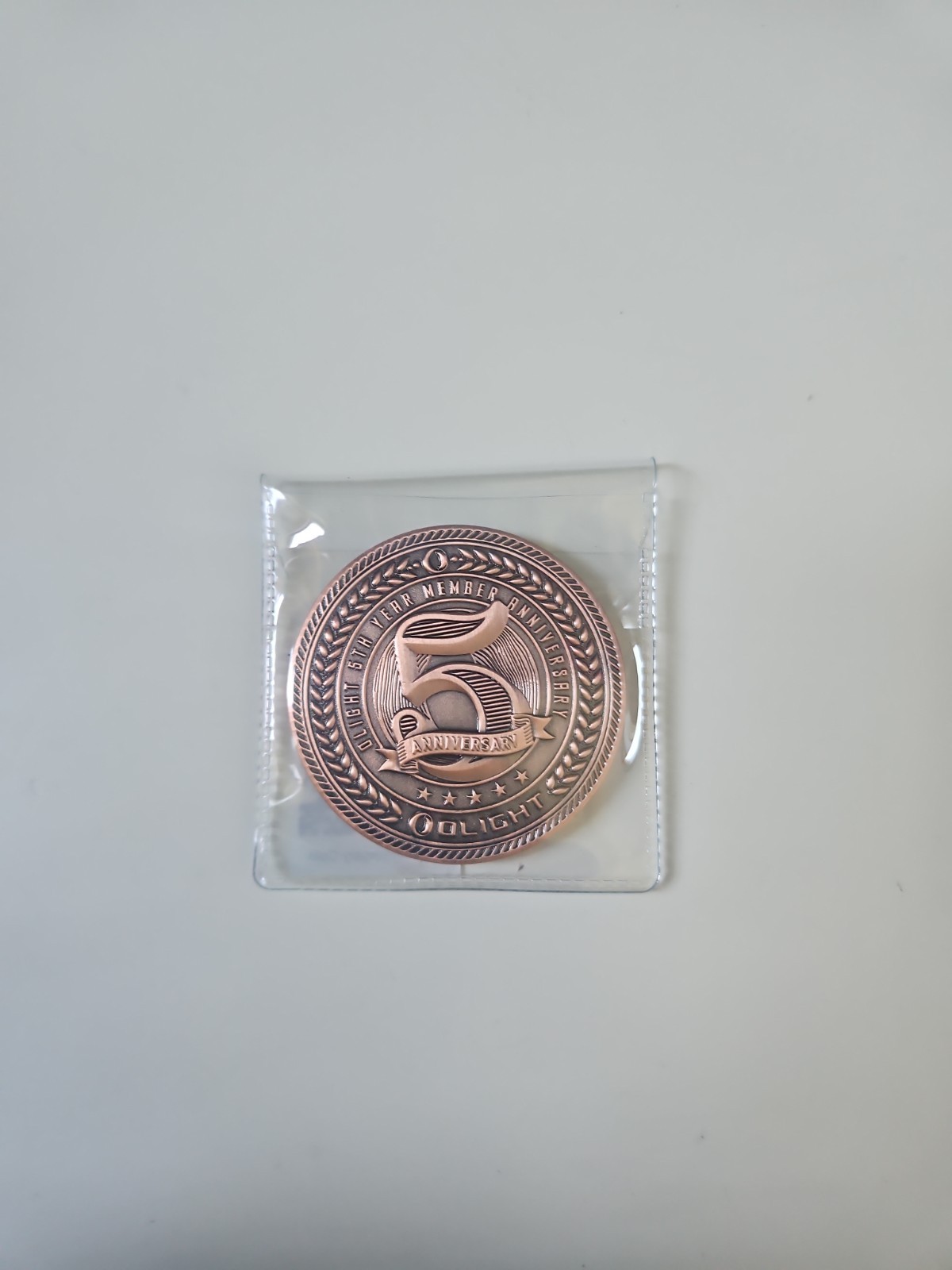 Olight 5 year anniversary coin