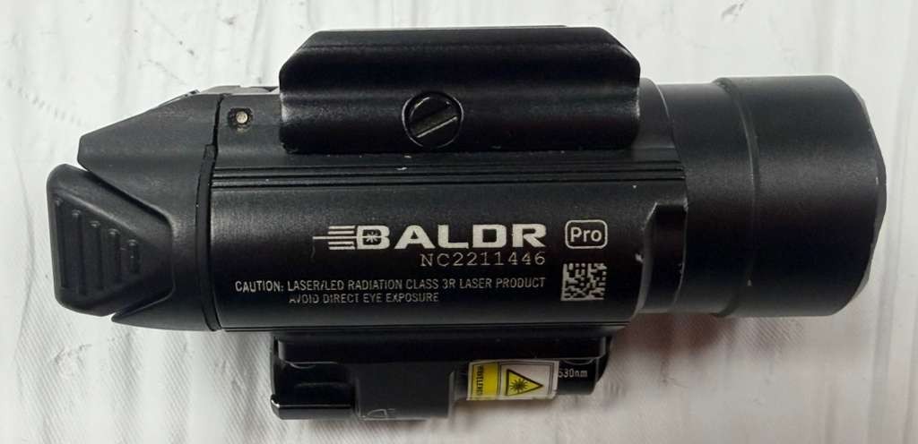 Used Olight Baldr Pro 1350 Lumen Pistol Flashlight w/ Green Laser Sight (Black)