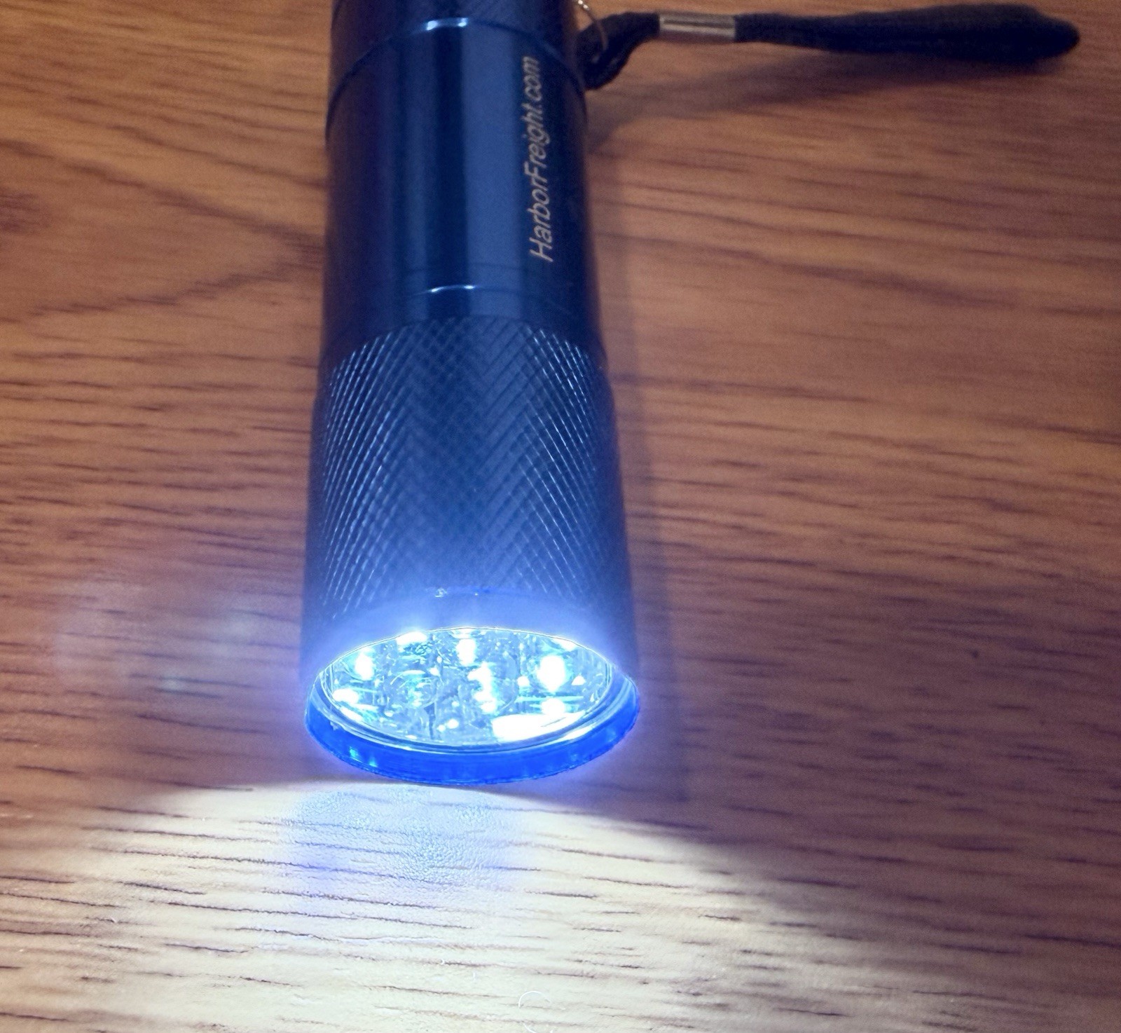 Harbor Freight branded mini aluminum flashlight with a blue finish 3.5”L