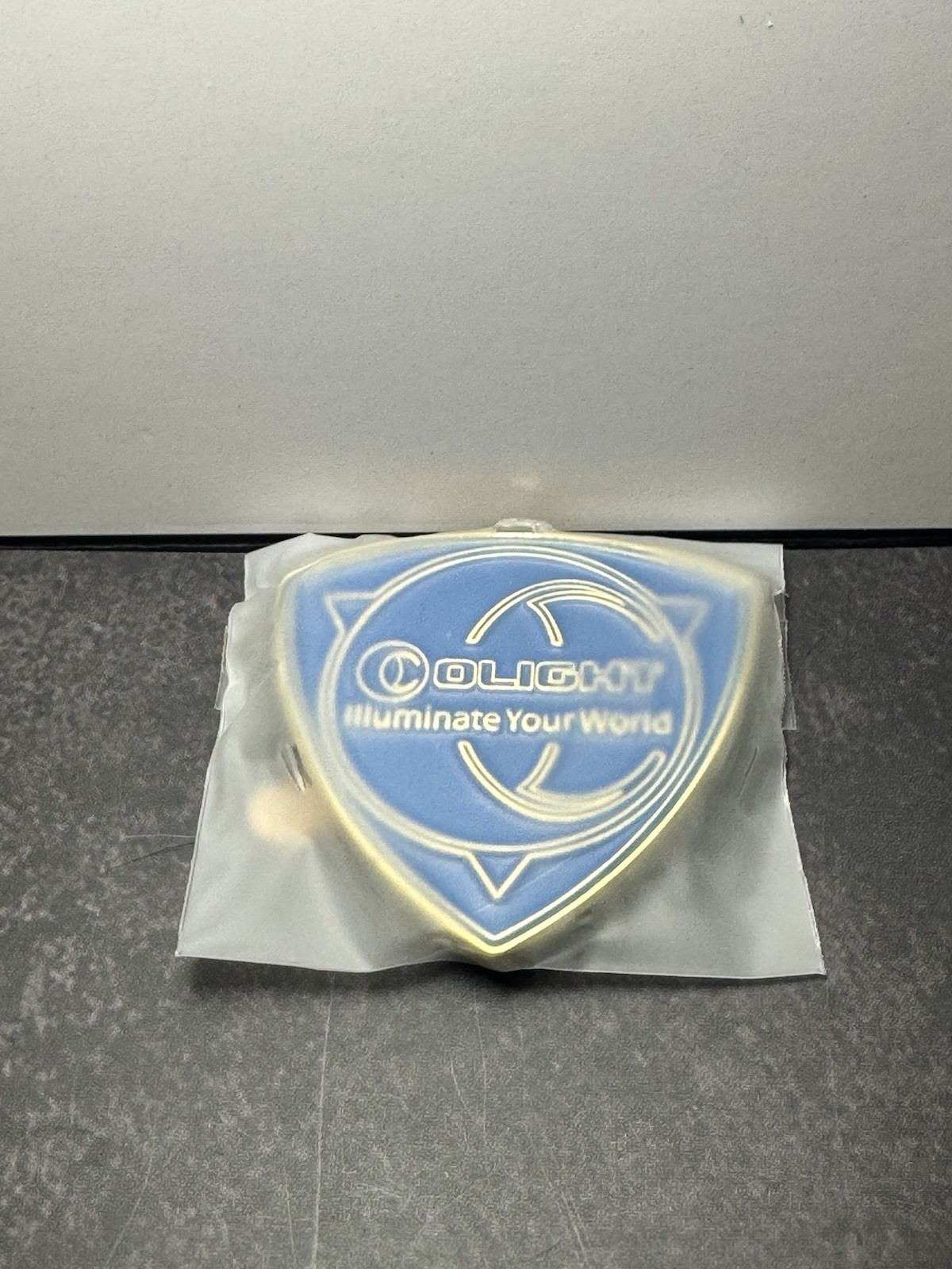 Olight Obulb Metal Coin With 3M Adhesive Back Swag Collectable