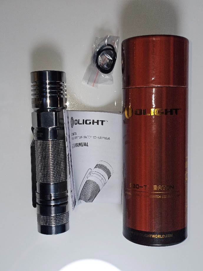 NIB OLIGHT S30 Ti Baton polished Flashlight. RARE Collectors item